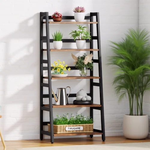 Tall black and wood ladder shelf filled with colorful plants and decor